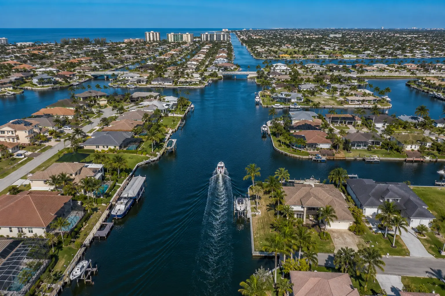 Modern Cape Coral new construction home design with open layout and outdoor living