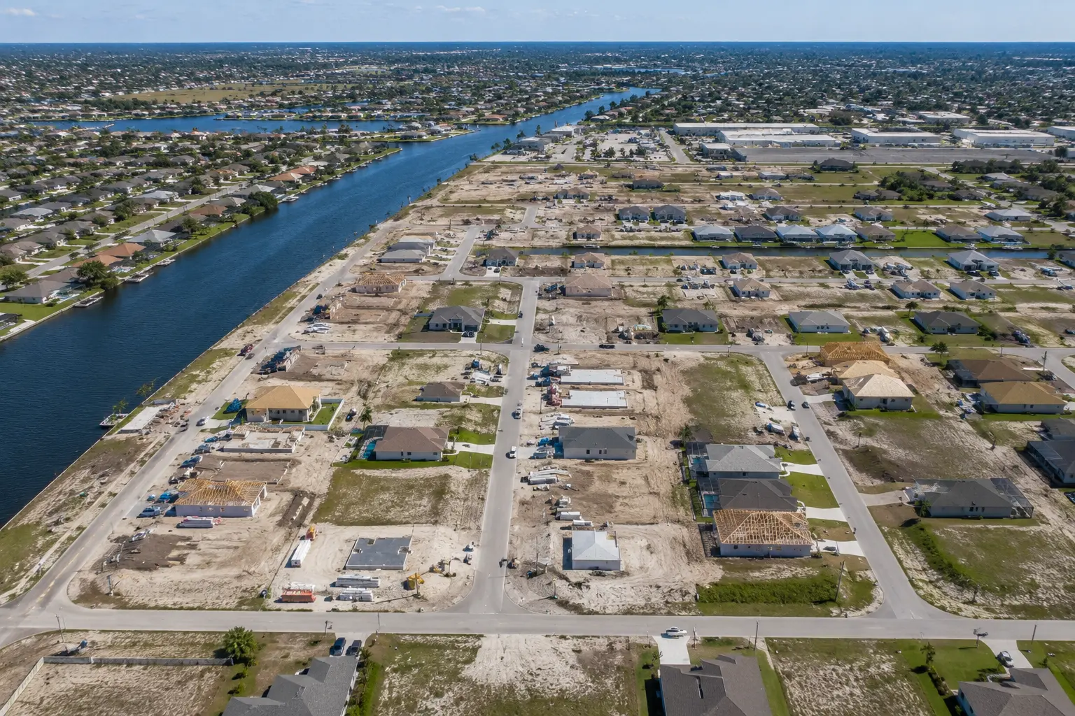 Family relocating to Cape Coral building a semi-custom home with home office open layout large lanai and pool