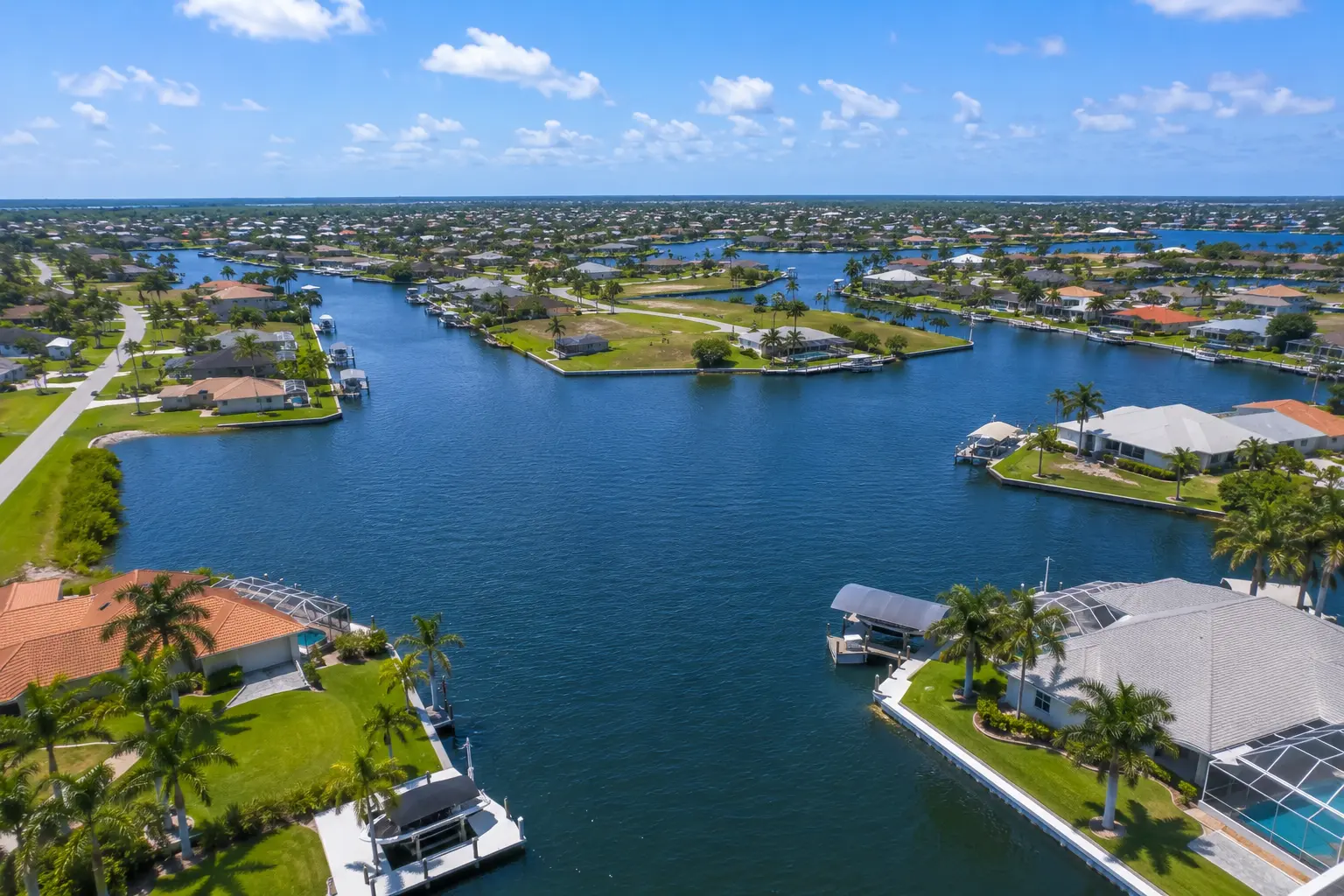 Cape Coral waterfront lot with dock boat lift composite decking and future canal improvements